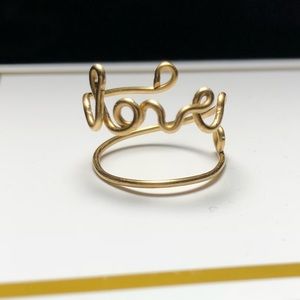 Dainty handmade gold “love” ring